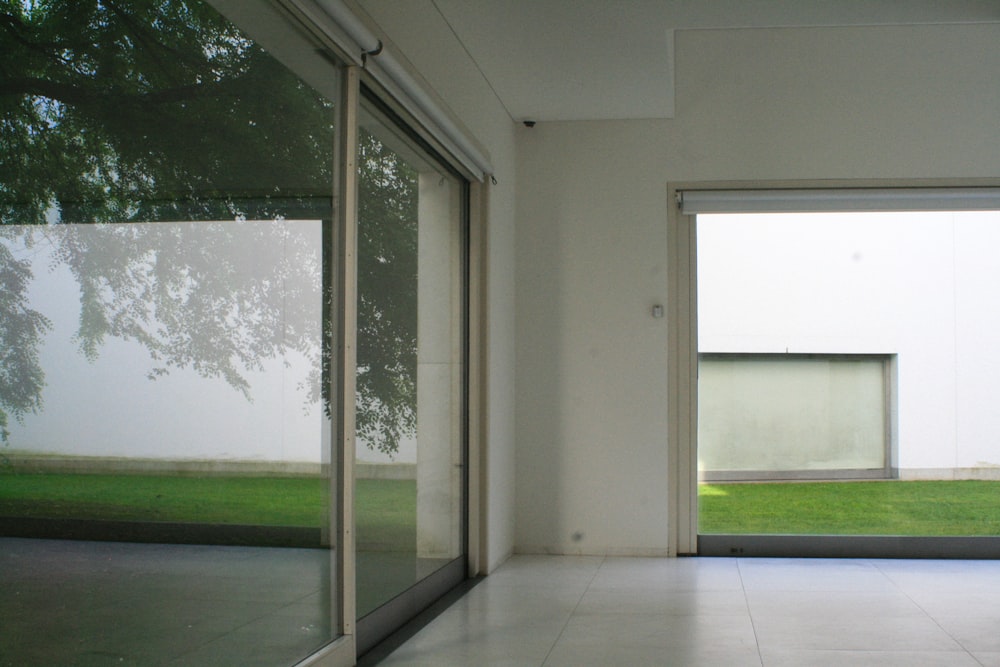 an empty room with a sliding glass door