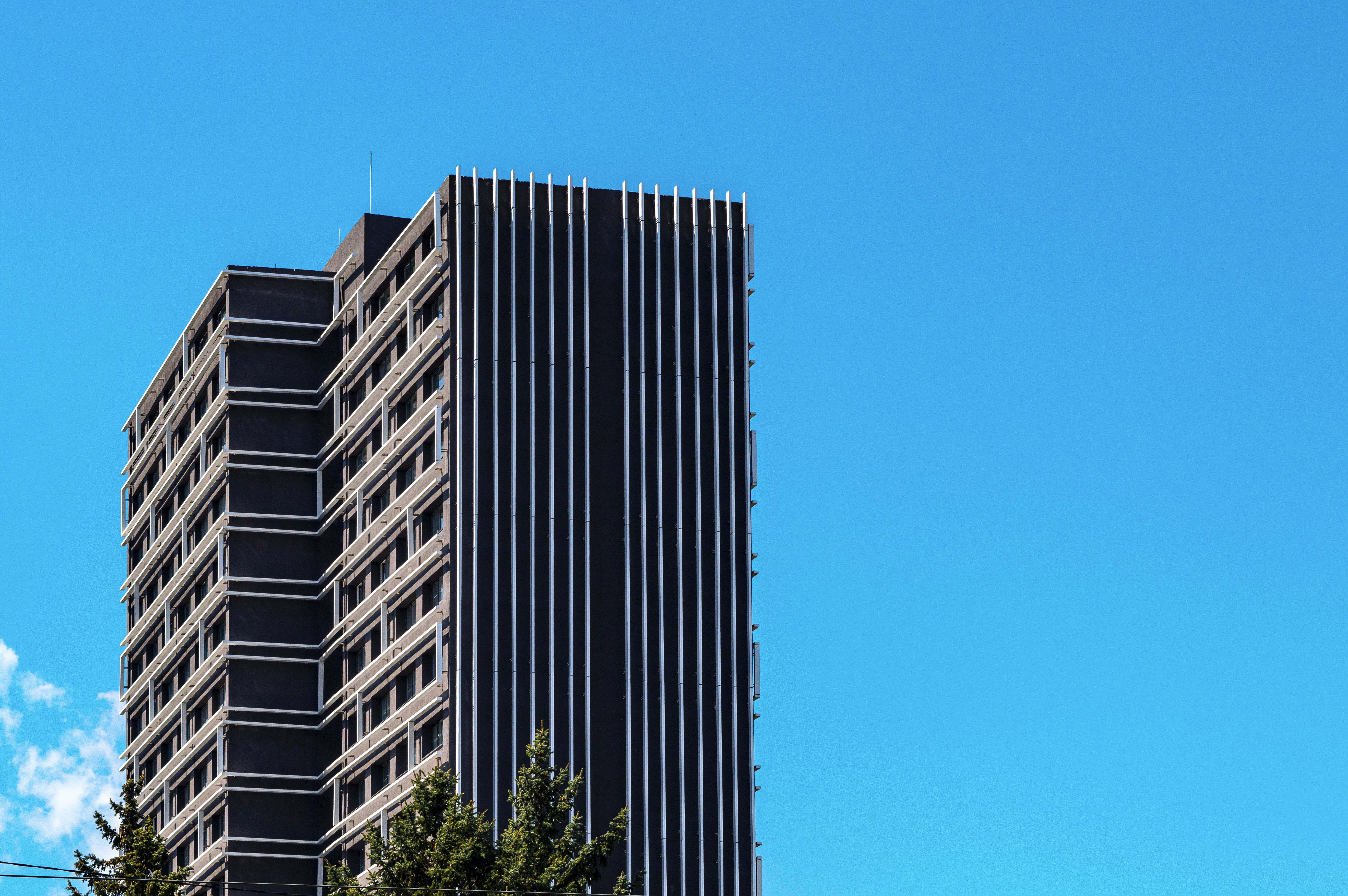 a tall building with a clock on the side of it