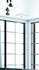 Modern living room with Ventiso pleated insect screens on large windows.