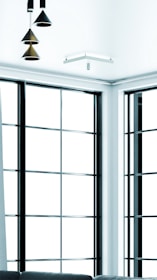 Modern aluminum window frame installed in a bright, contemporary home setting.