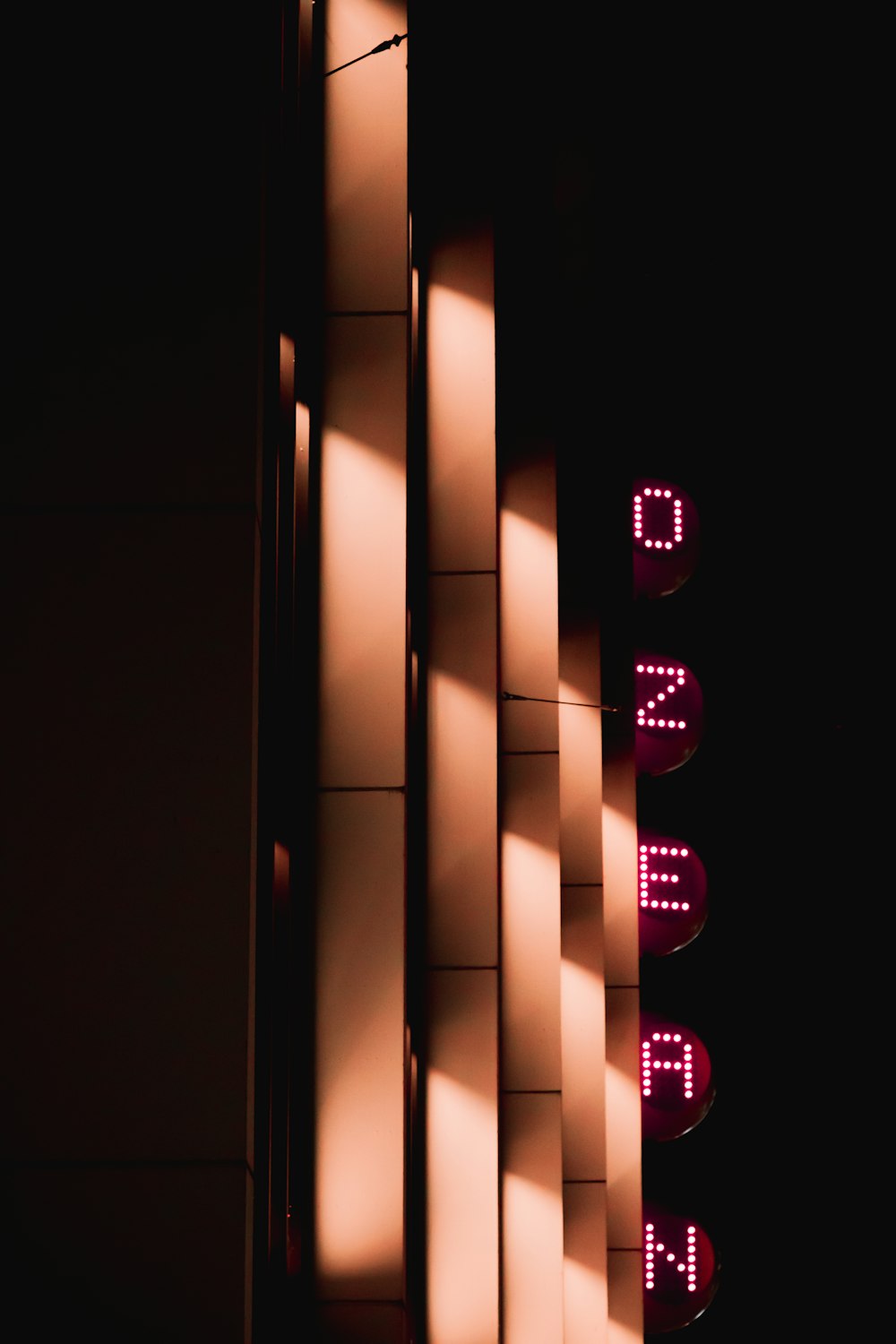 a close up of a street sign on a building