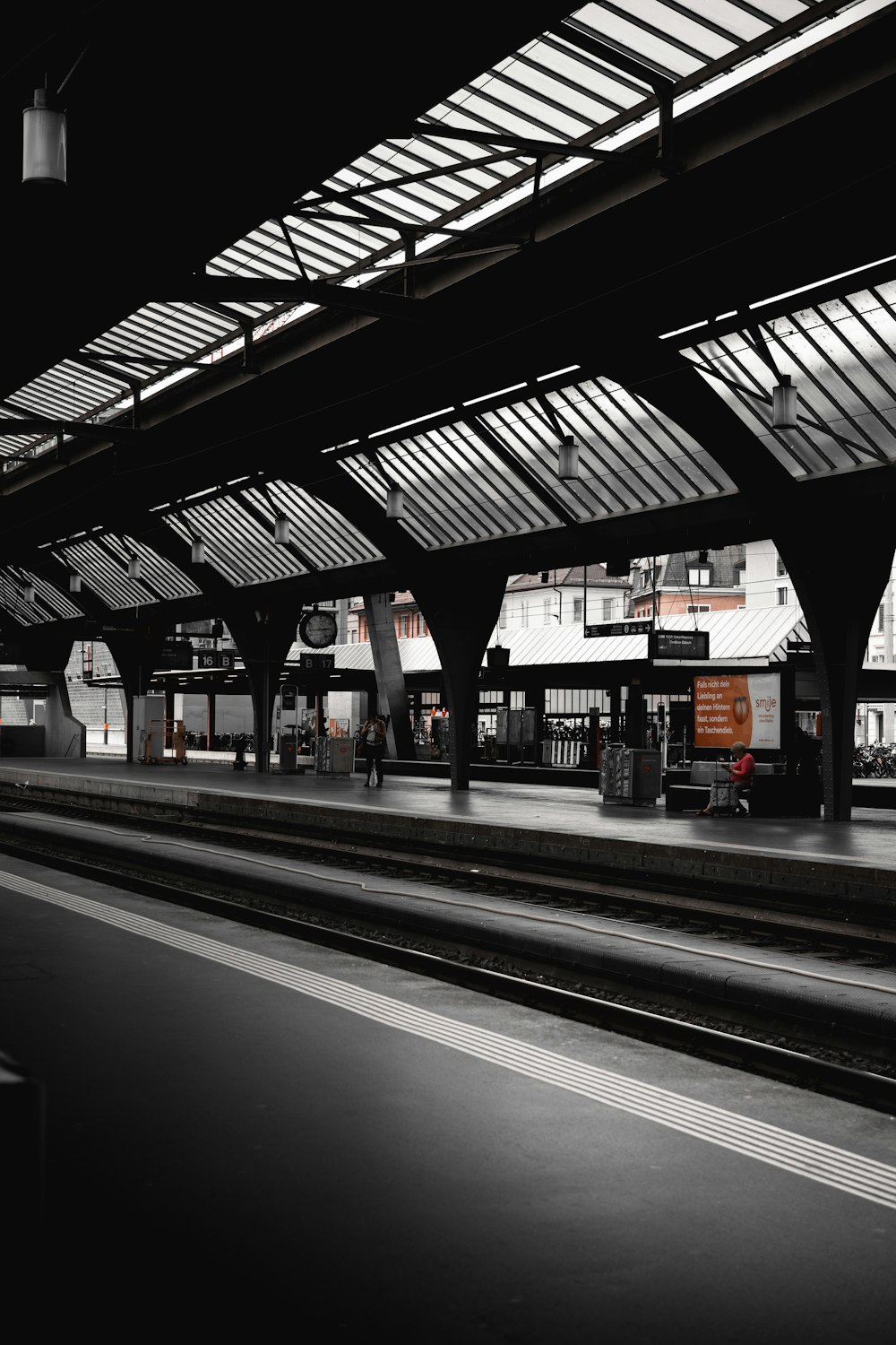 a black and white photo of a train station