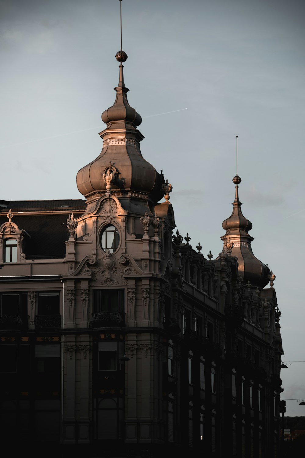 a tall building with a clock on the top of it