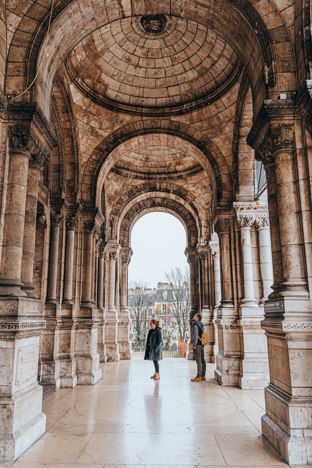 a couple of people that are standing in a building