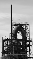 a black and white photo of a large pipe