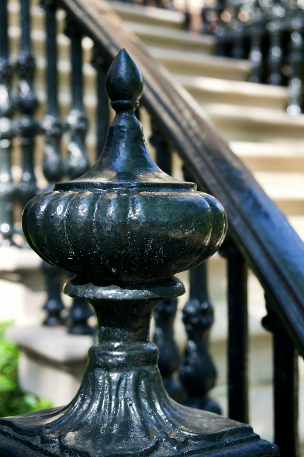 a close up of a metal railing with a hand rail