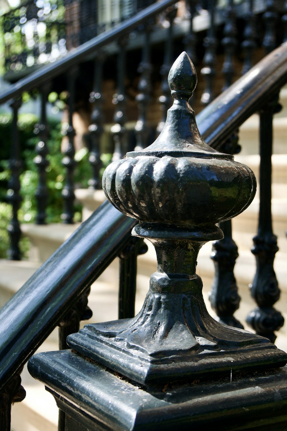 a close up of a metal hand rail on a stair case