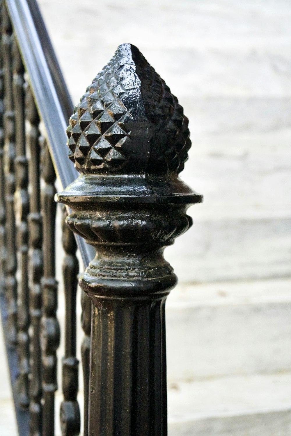 a close up of a wrought iron fence