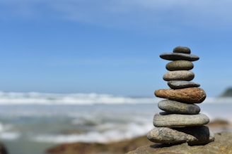 a stack of rocks sitting on top of a beach