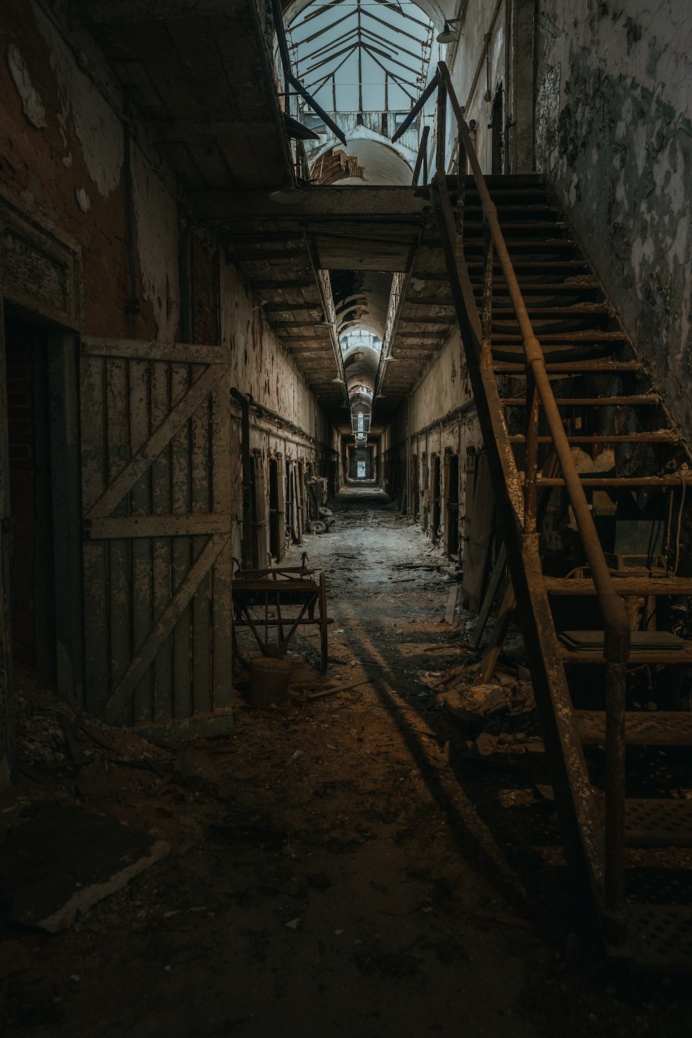 an abandoned building with a staircase leading up to the second floor