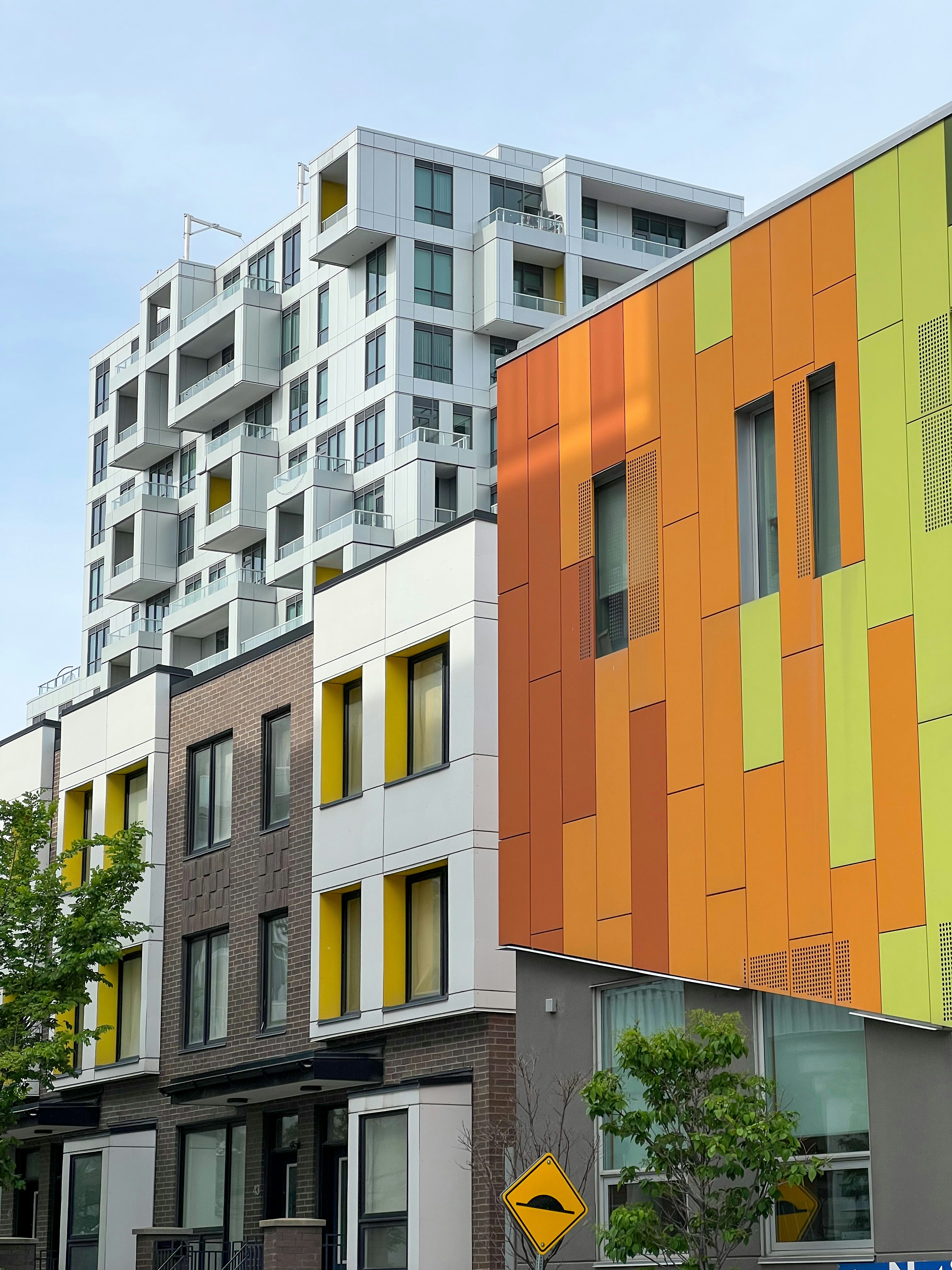 A row of multi - colored apartment buildings next to each other photo ...
