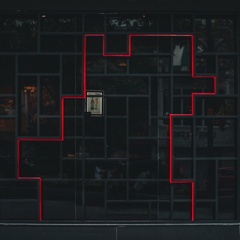 a black building with a red line on the side of it