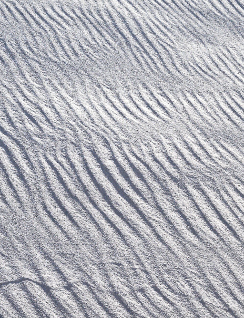 a person riding skis down a snow covered slope