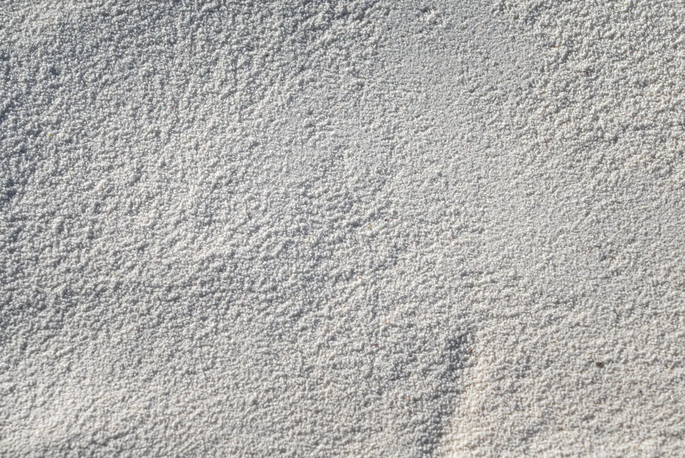 a large amount of white sand on a beach