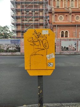 A volunteer installing a defibrillator box on a busy street corner in Doncaster.