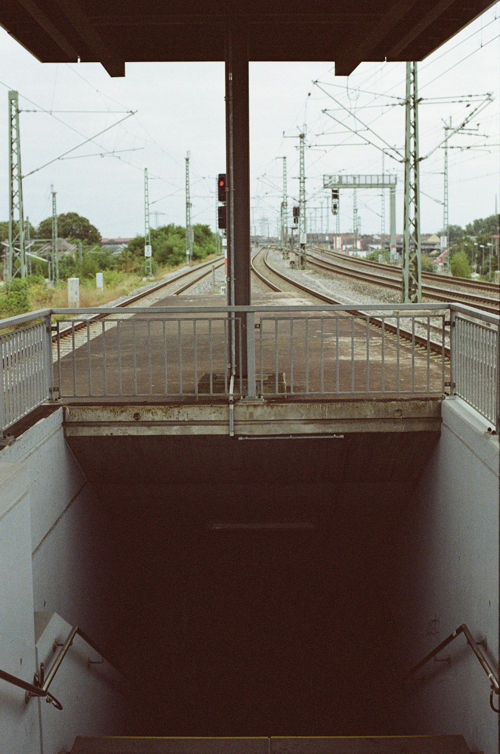 a set of stairs leading to a train station