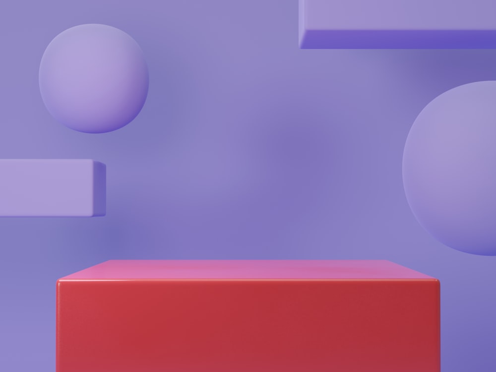 a purple and red object is in front of a purple wall