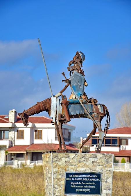 a statue of a man on a horse with a sword