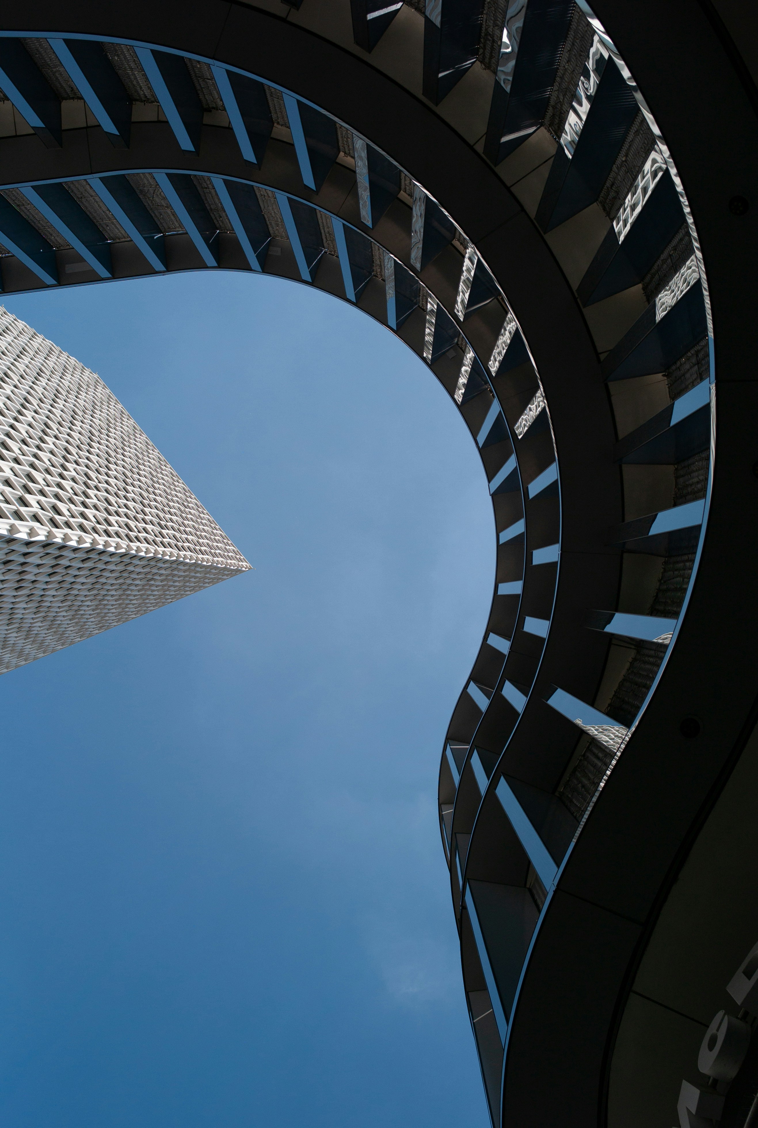 a very tall building towering over a city