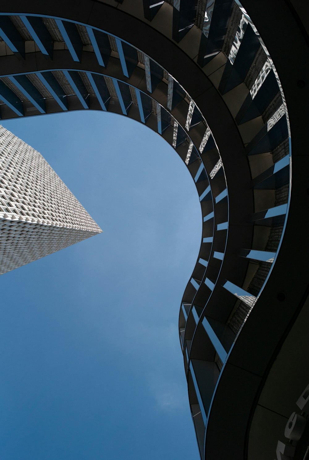 a very tall building towering over a city