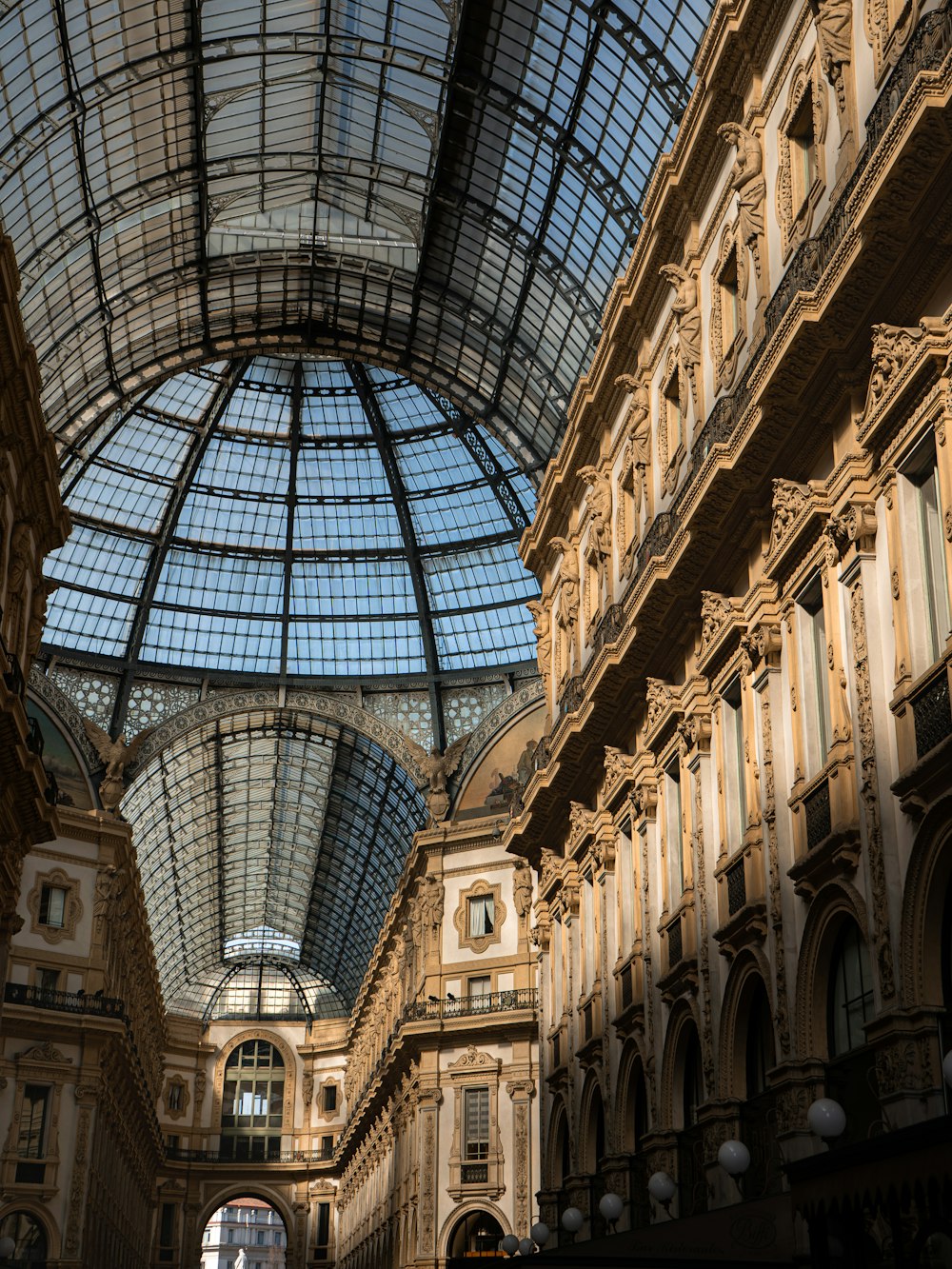 a large building with a glass ceiling and a clock