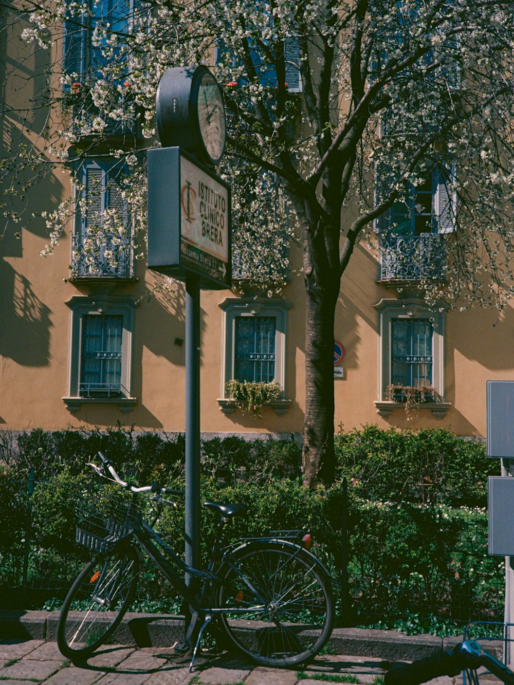 a bicycle parked next to a parking meter