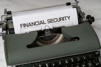 a close up of a typewriter with a financial security sign on it