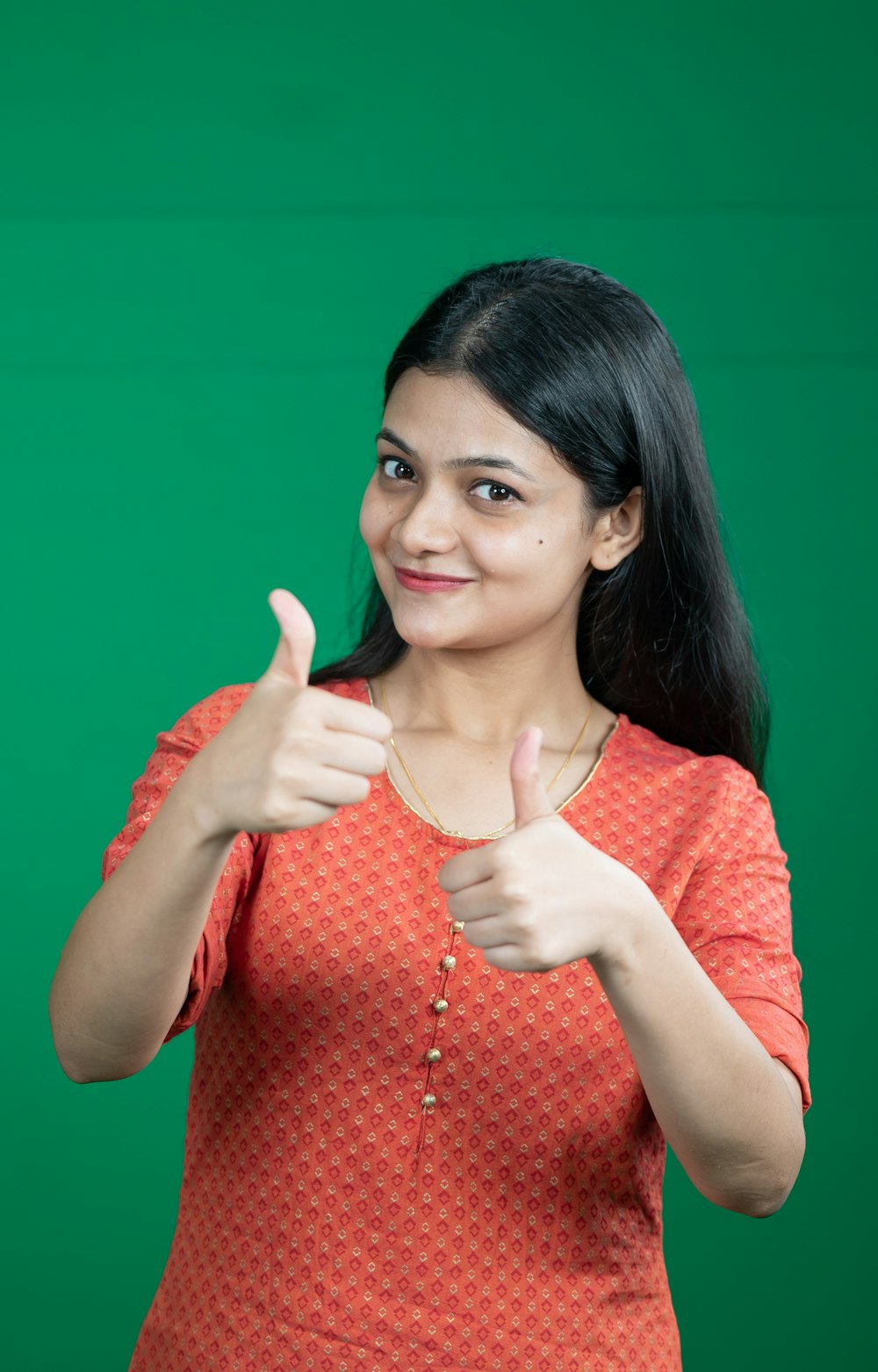 a woman giving a thumbs up sign