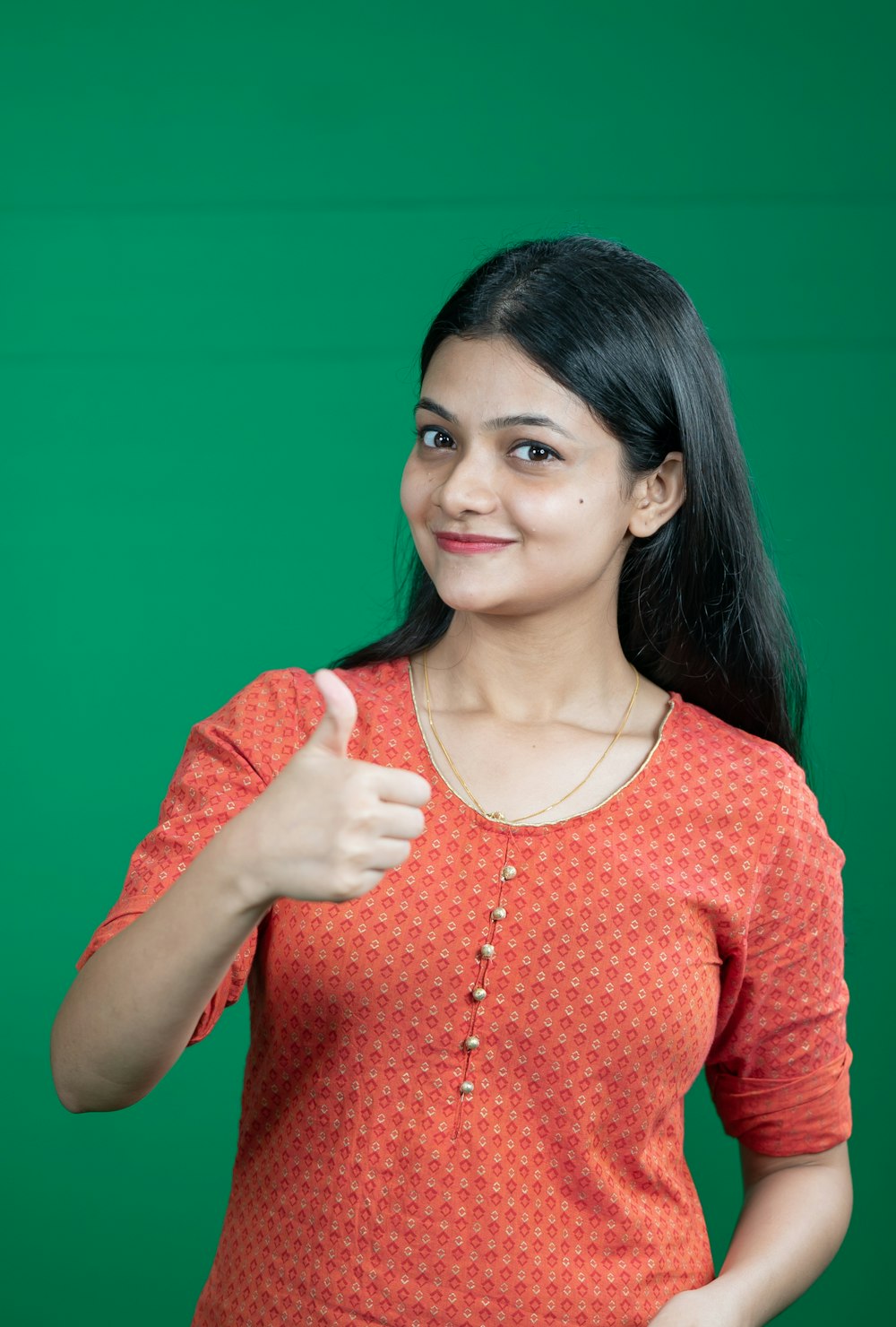 a woman giving a thumbs up sign