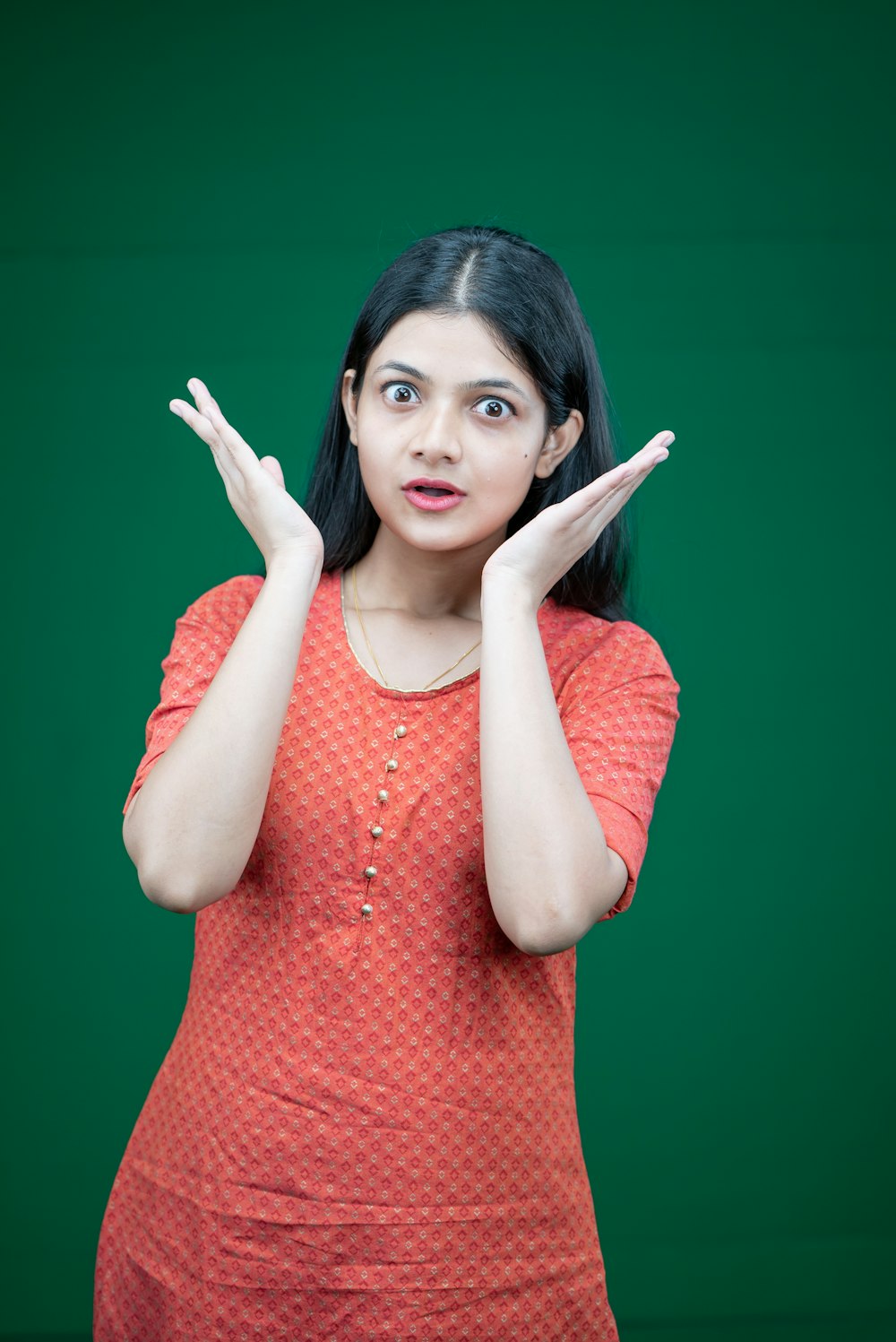 a woman making a hand gesture with her hands
