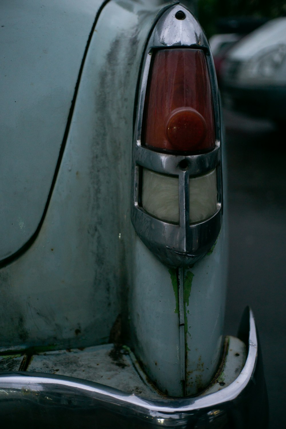 a close up of the tail light of an old car