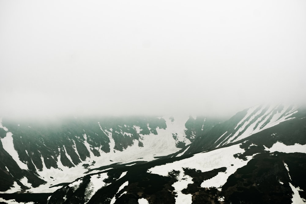 a view of a snow covered mountain from a plane