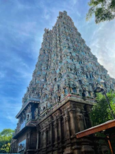 Vibrant photo of the Palnadu Sri Maha Saiva Kshetramu temple framed by a clear blue sky.