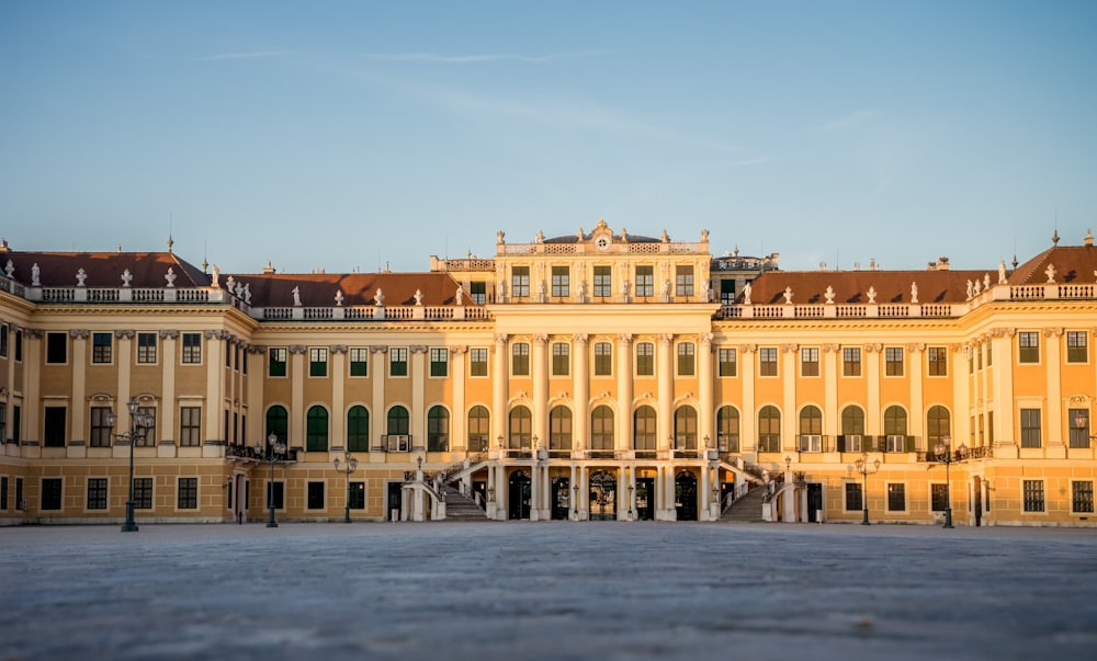 a large yellow building with a lot of windows