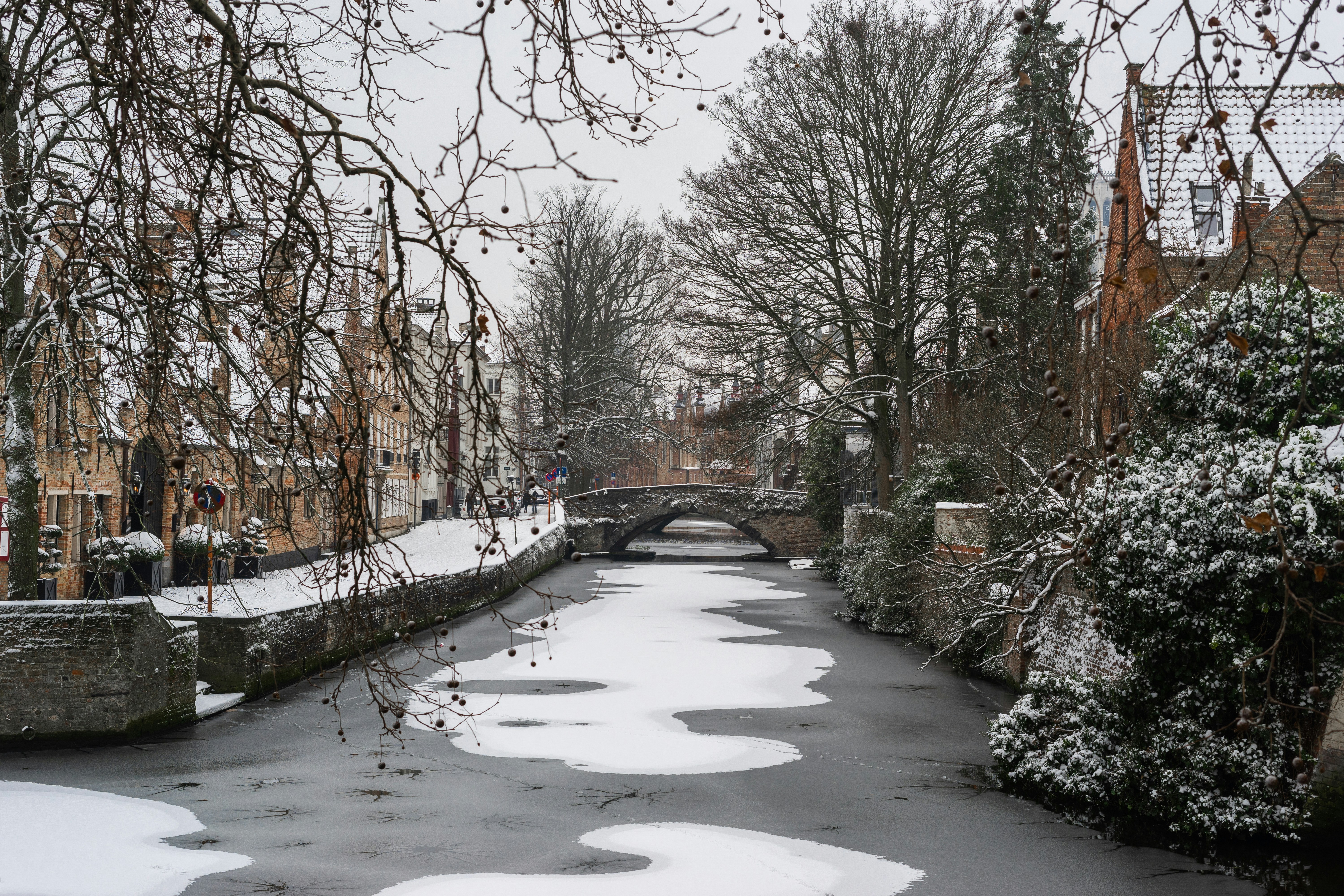 a river running through a snow covered town