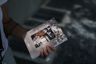 a person holding a book in their hand