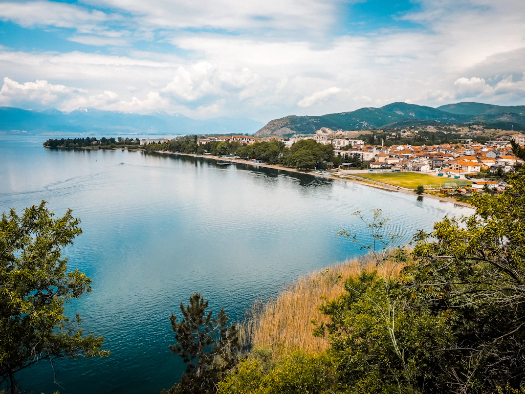 The pristine waters of Lake Ohrid rolling against the shore