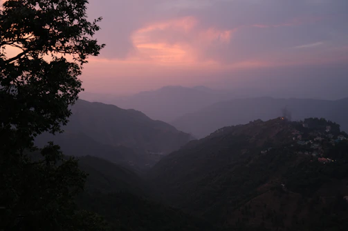 A scenic view of Albanian mountains near Tirana during sunset.