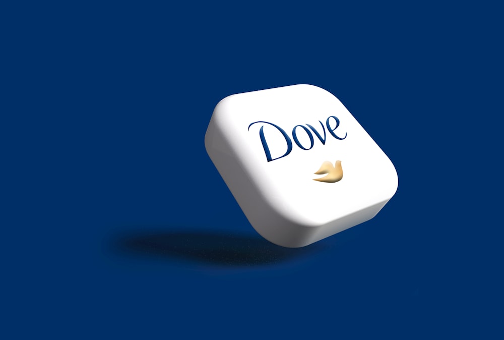 a white dice with the word dove on it