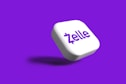 a white dice with the word zelle on it