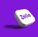 a white dice with the word zelle on it