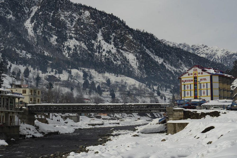 a river running through a snow covered mountain side