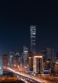 a city at night with a lot of traffic