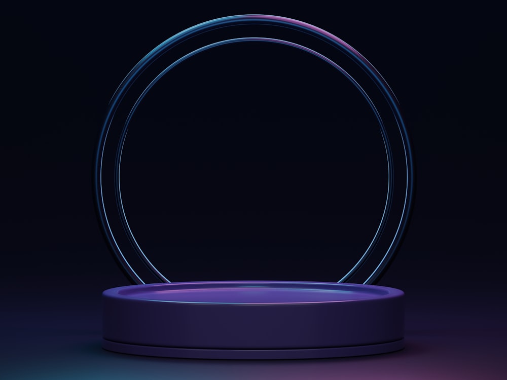 a circular object with a blue base on a dark background