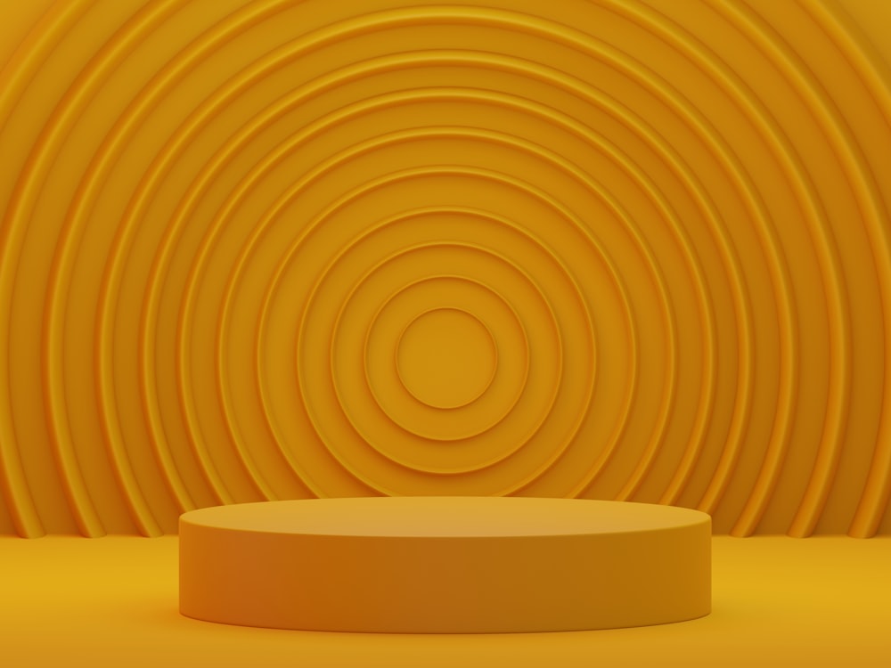 a round yellow object in front of a yellow background