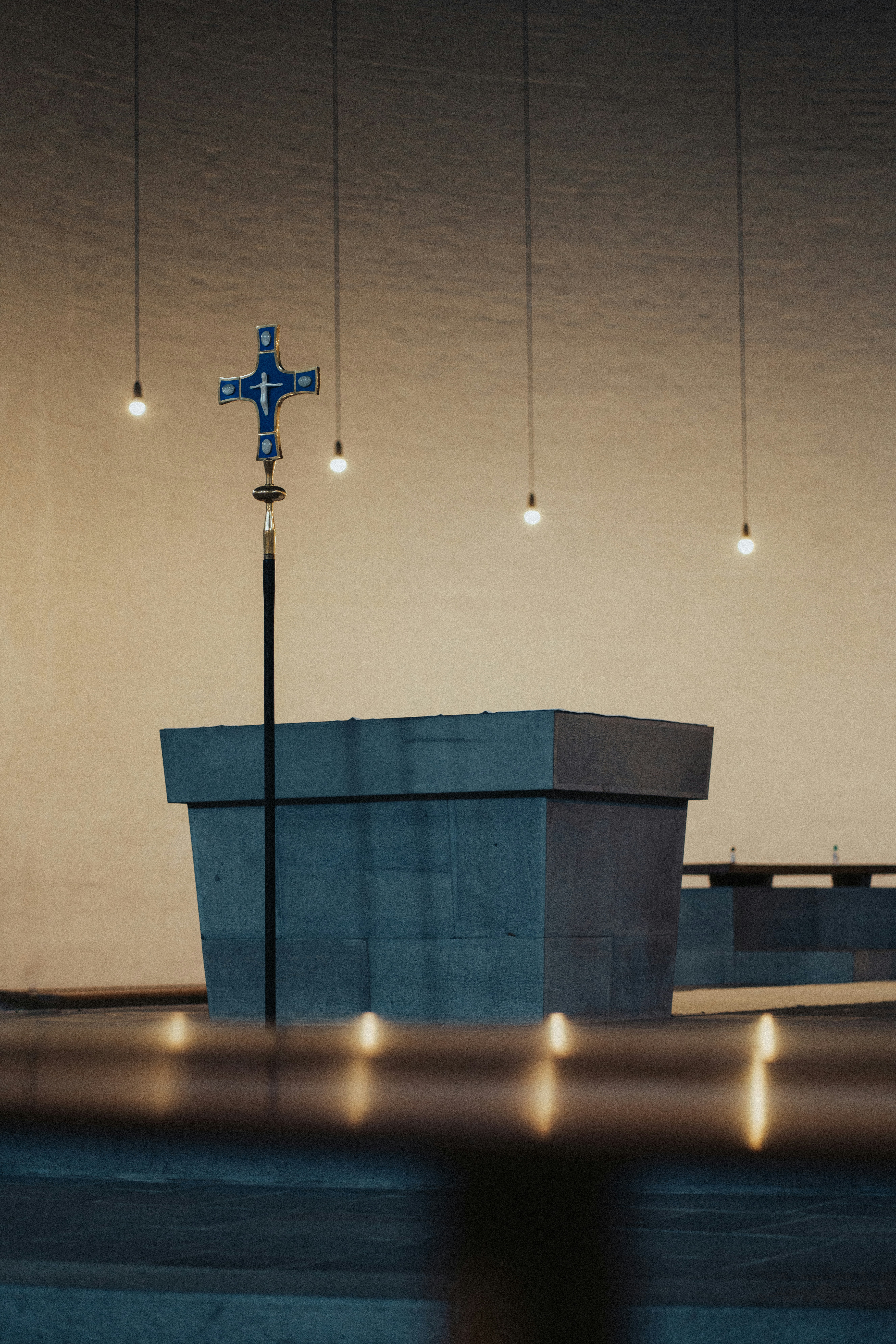 a blue cross on top of a building