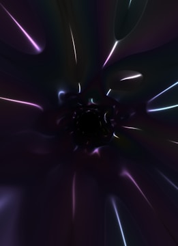 The image features a dark, abstract scene with glowing, iridescent lines and shapes. The colors blend into one another, forming a vortex-like structure that draws the eye towards the center. The overall composition creates a sense of depth and mystery.