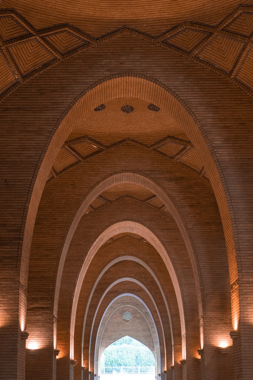 a very long hallway with a clock on the wall