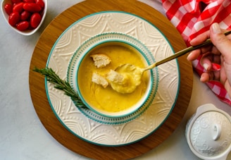 a bowl of soup with a spoon in it