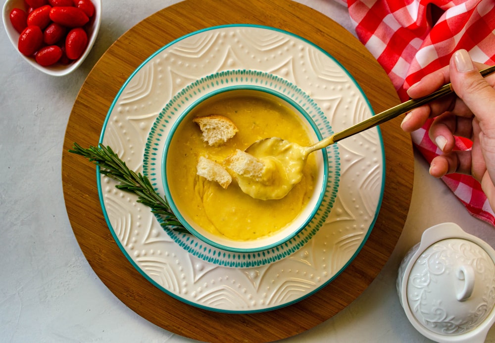 a bowl of soup with a spoon in it